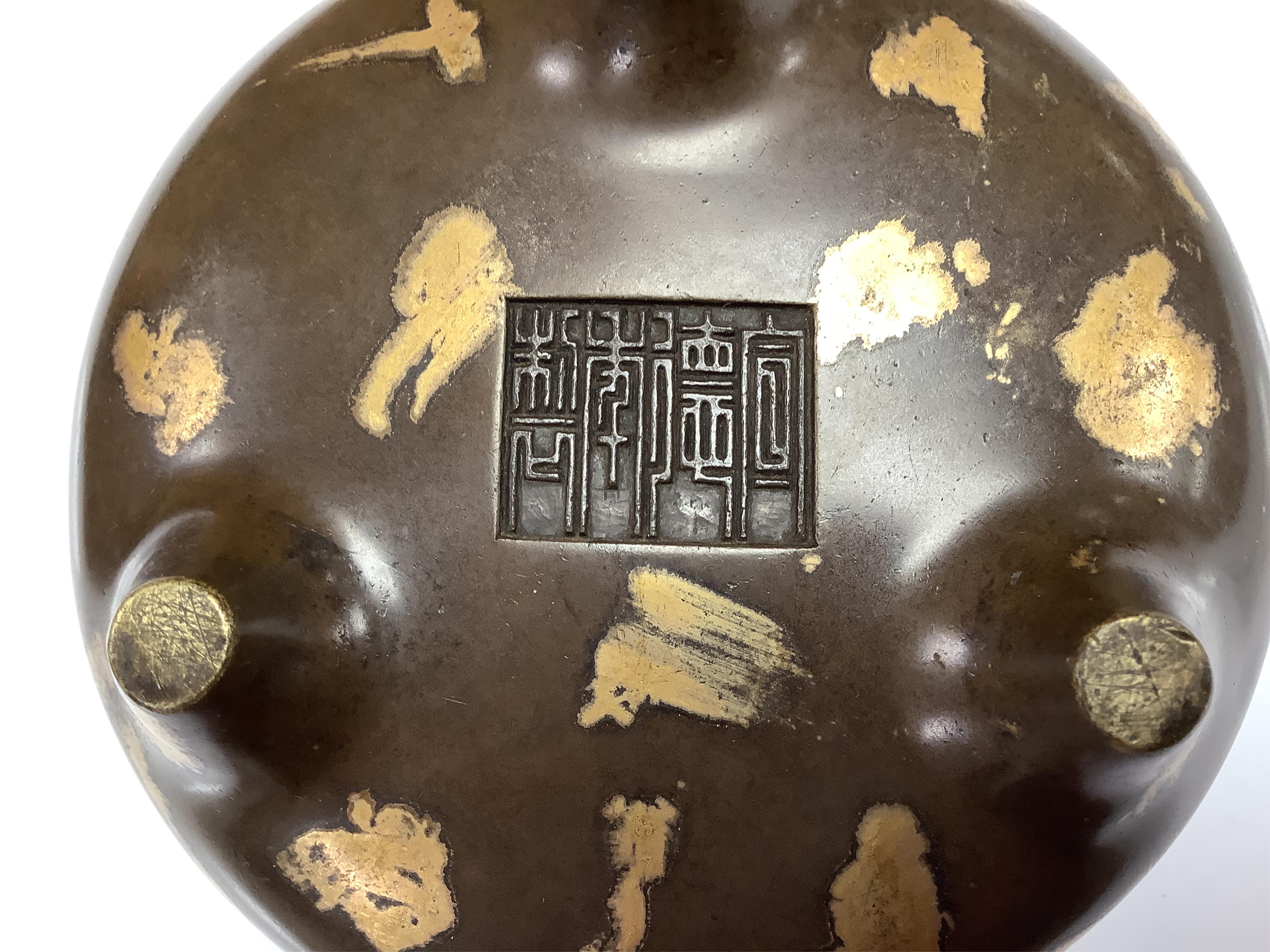 A Chinese gold splash bronze censer, Xuande seal mark to underside, 11cm wide. Condition - good